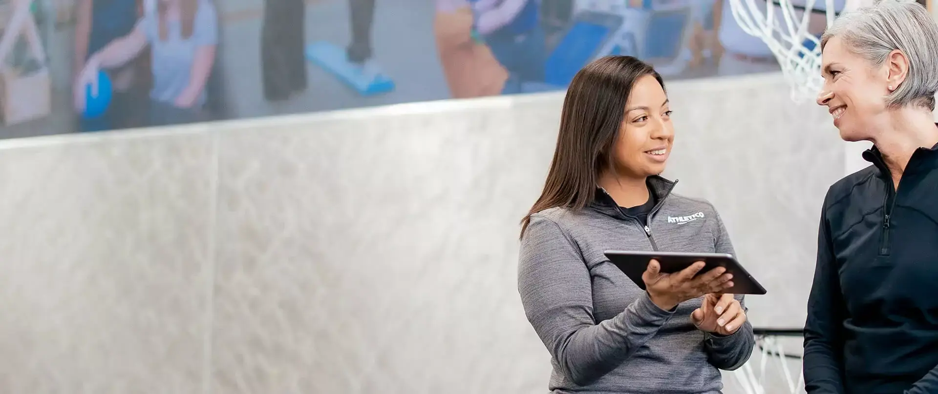 Physical therapist interacting with a patient