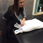 Place rolled up towel at base of pillow